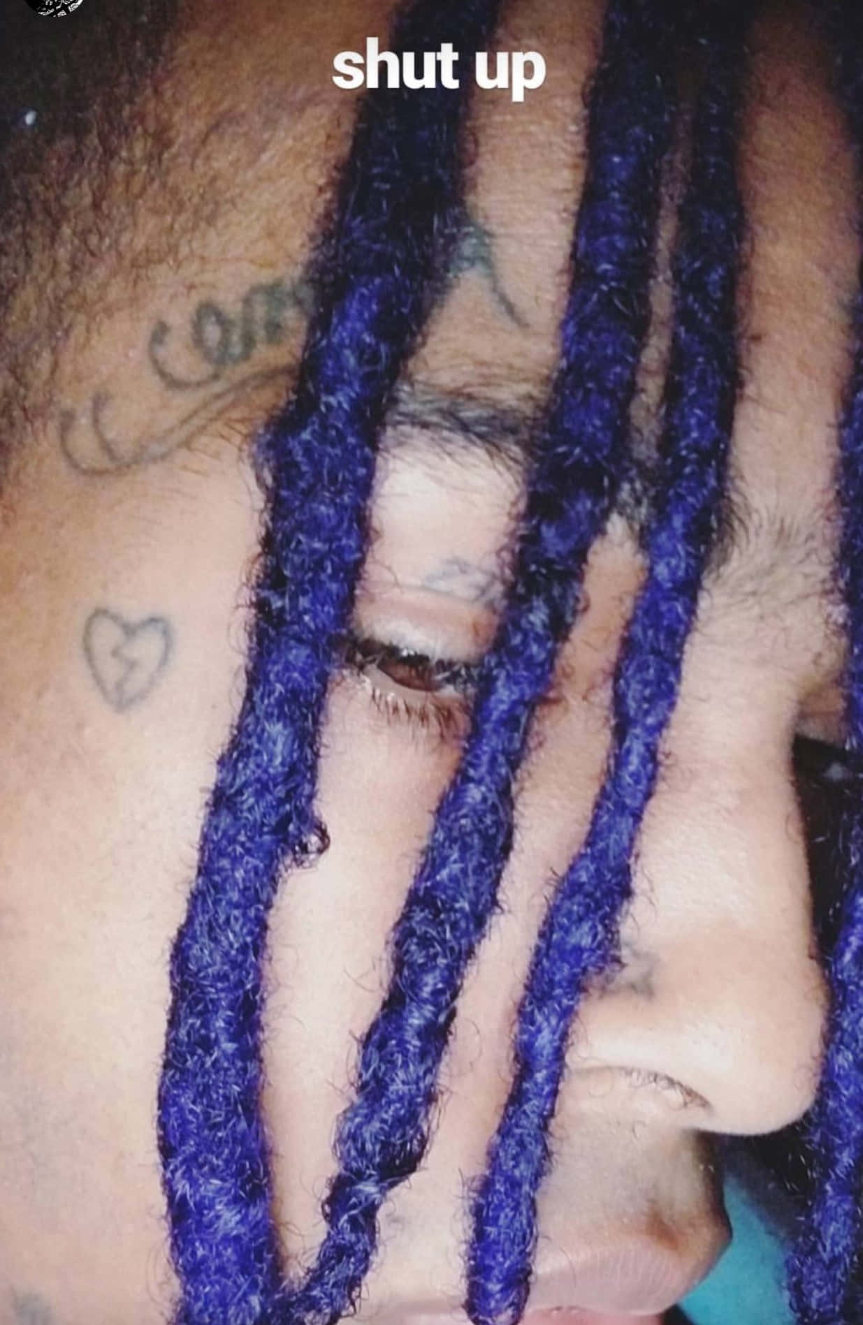 The Late American Rapper Xxxtentacion Sporting His Iconic Blue Hair Wallpaper