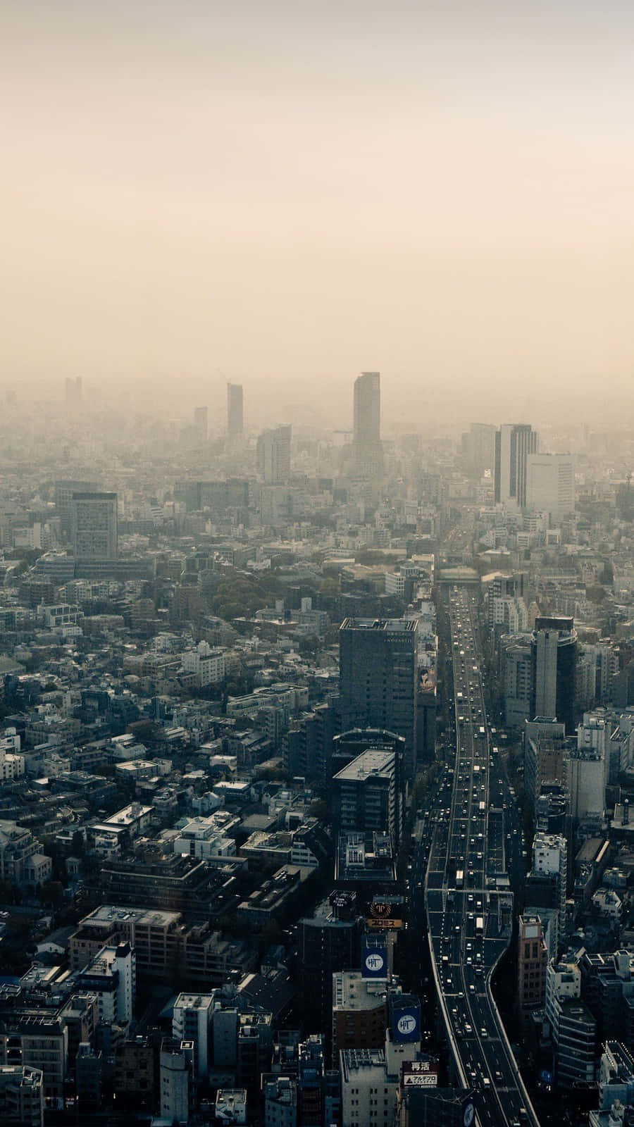 The Lights Of The City Illuminate The Dark Streets Of Japan Wallpaper