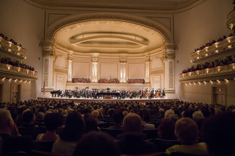 The Majestic Carnegie Hall Illuminated At Night Wallpaper