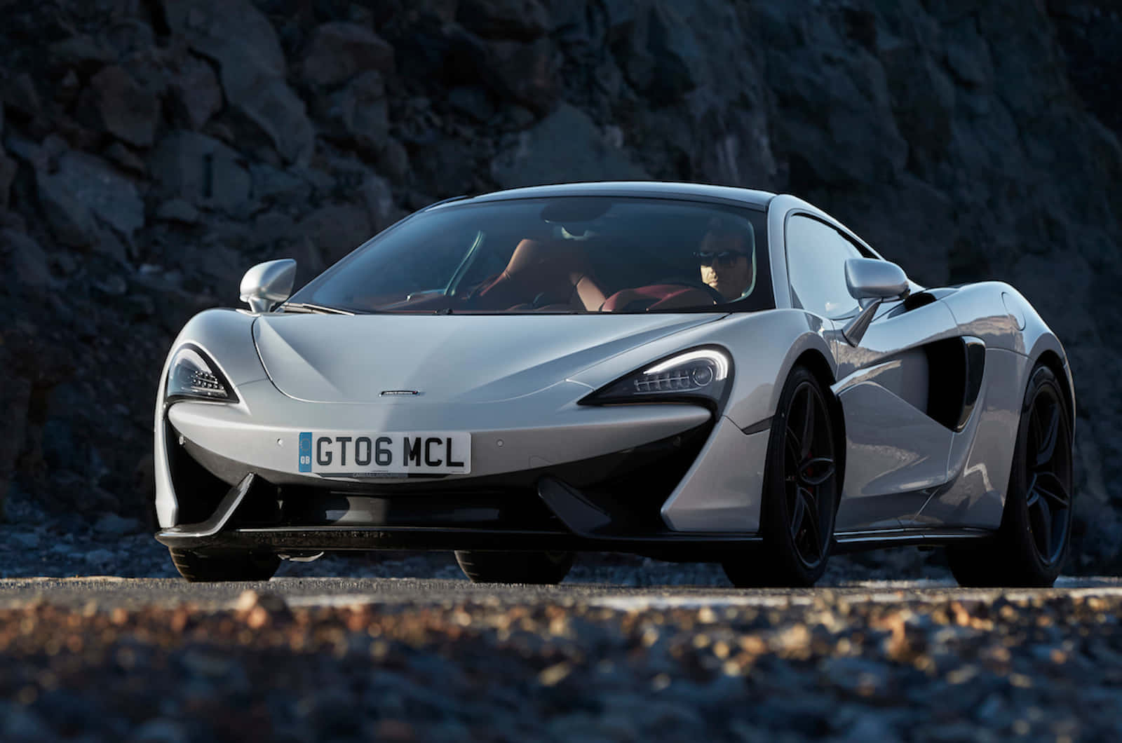 The Splendid Mclaren 570gt In Dynamic Motion Wallpaper