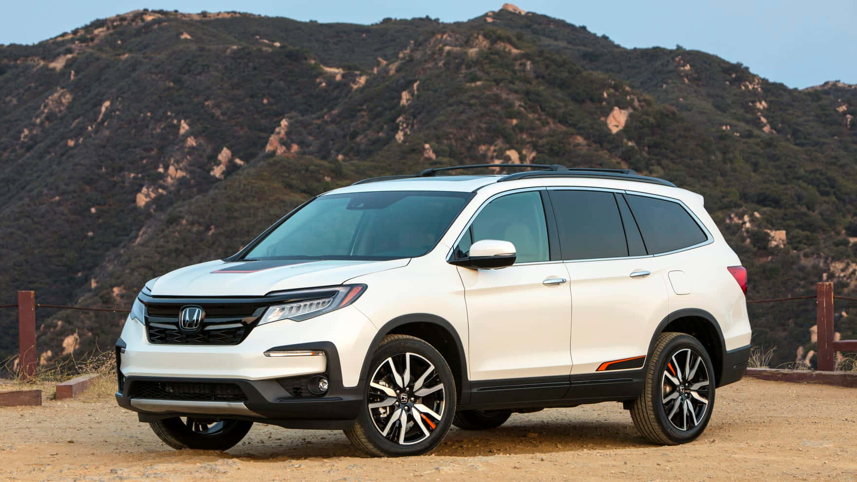 The Stunning Honda Pilot Cruising On The Open Road Wallpaper