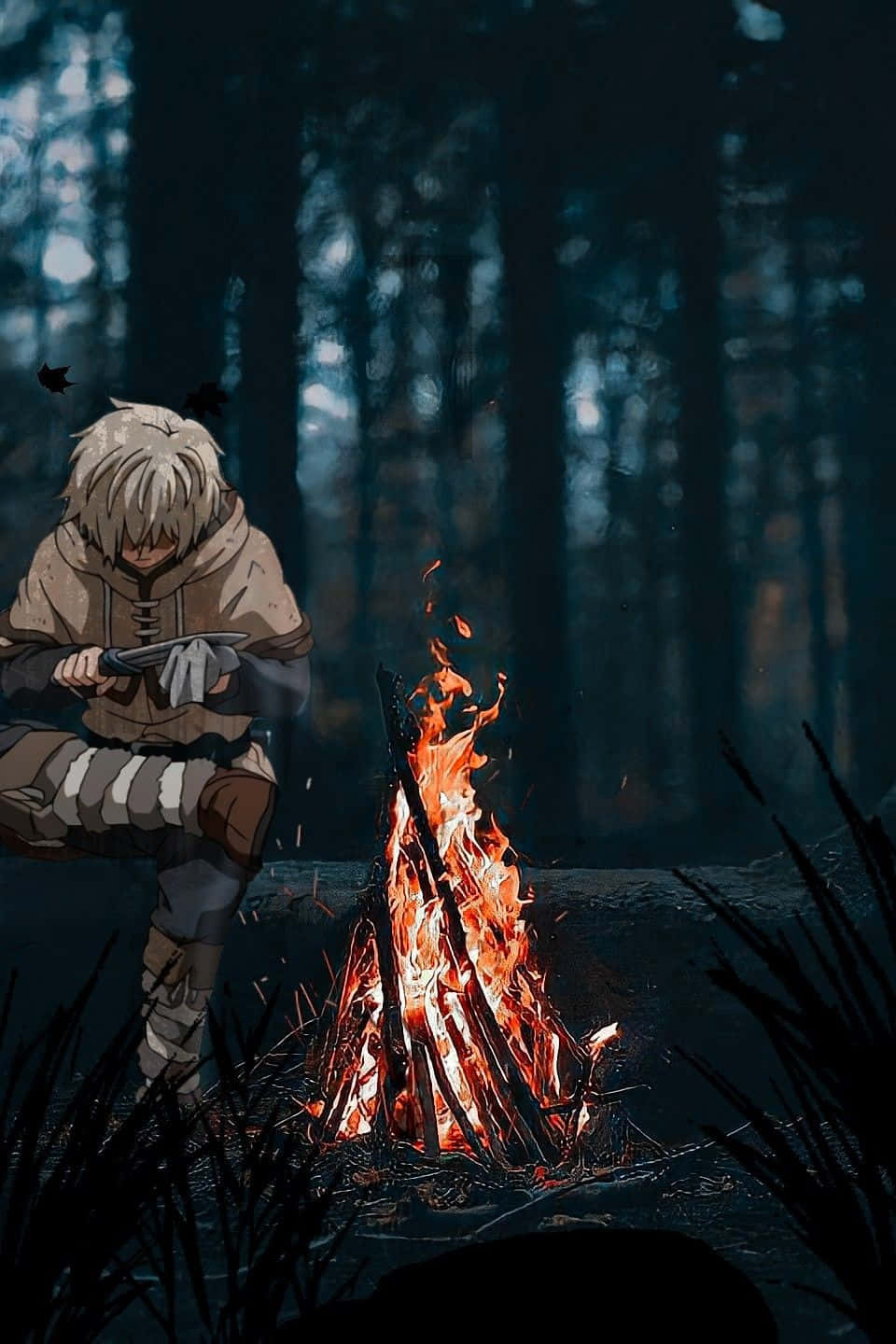 Thorfinn Beside Campfirein Forest Wallpaper