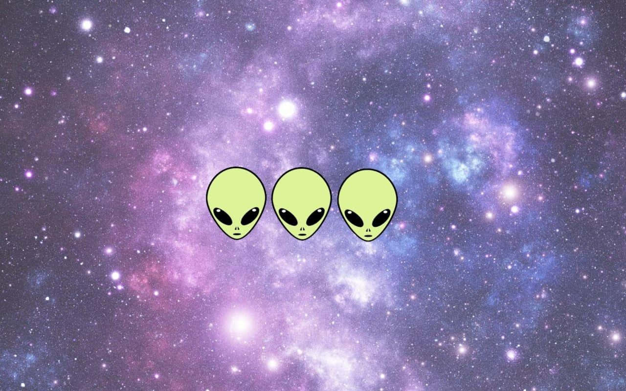 Three Aliens In Space With A Purple Background Wallpaper