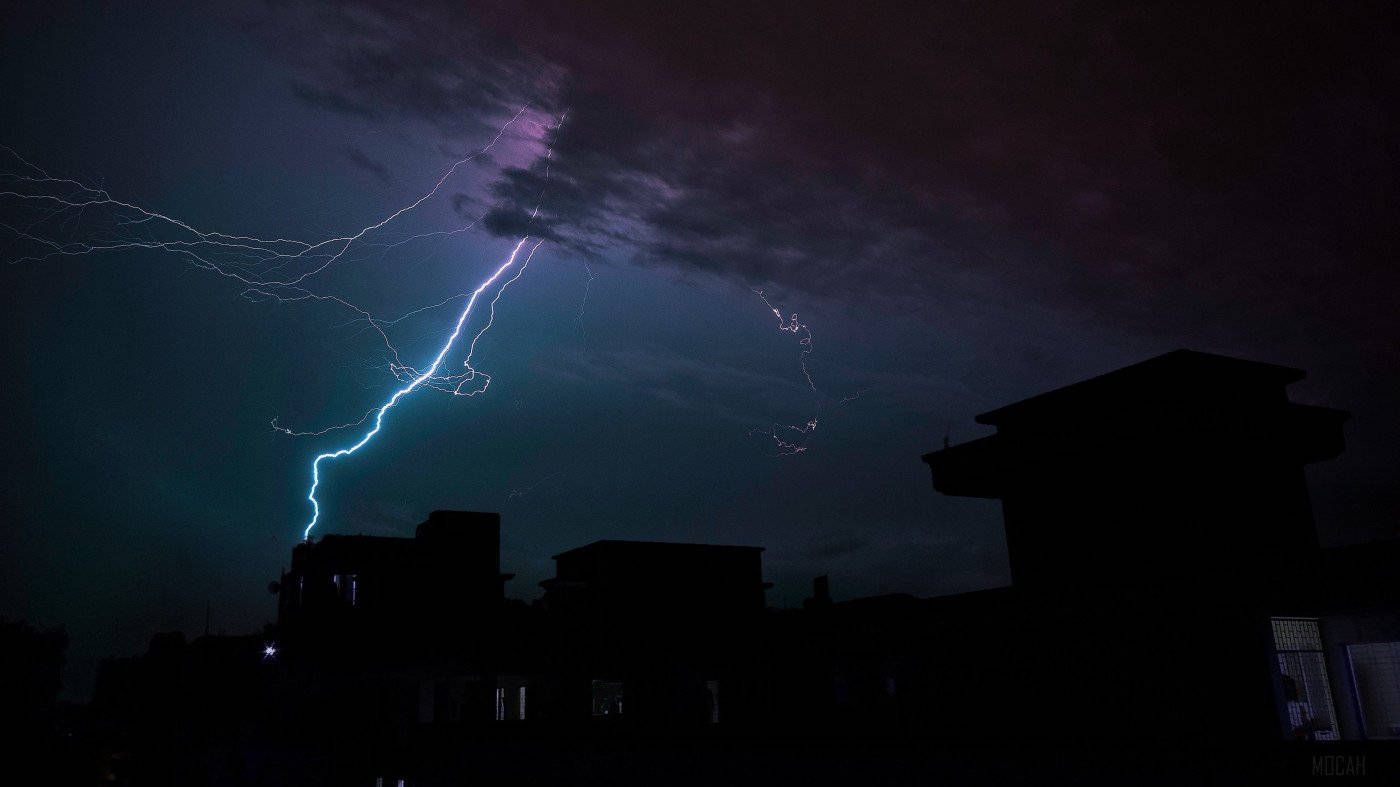 Thunderstorm Over Houses Wallpaper