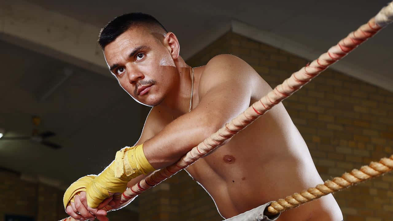 Tim Tszyu Posing With Boxing Gloves After A Victorious Match Wallpaper