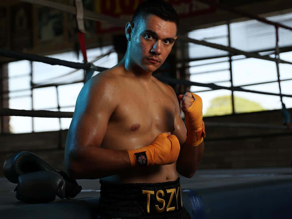 Tim Tszyu Showcasing His Fighting Stance In A Wallpaper Wallpaper