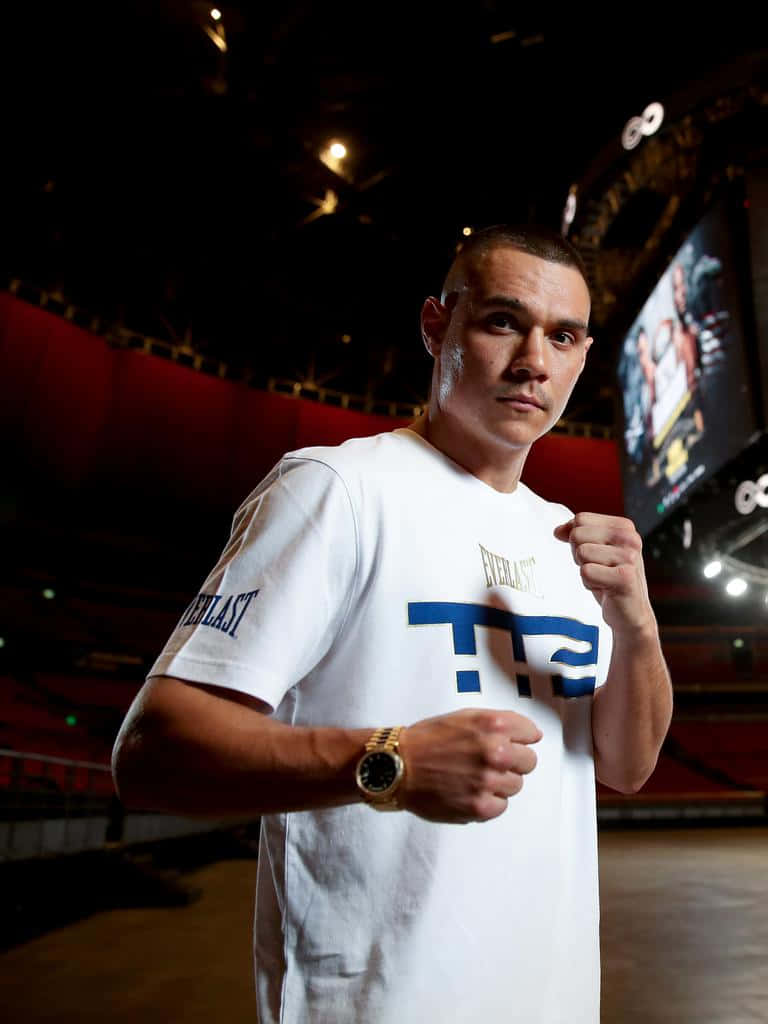 Tim Tszyu Standing Victorious In The Boxing Ring Wallpaper