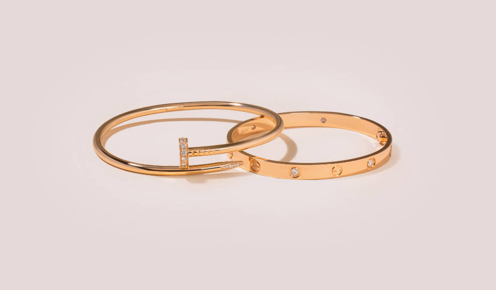 Timeless Luxury With Cartier Gold Nail Bracelet Wallpaper