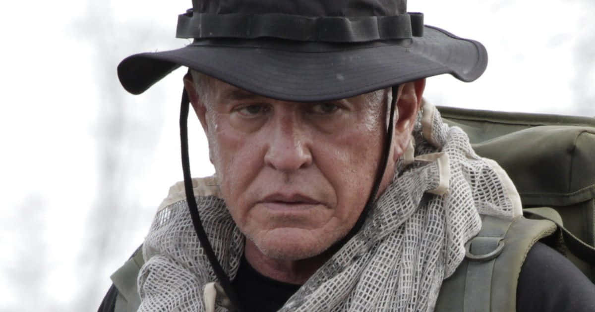 Tom Berenger Looking Focused In A Close-up Shot Wallpaper