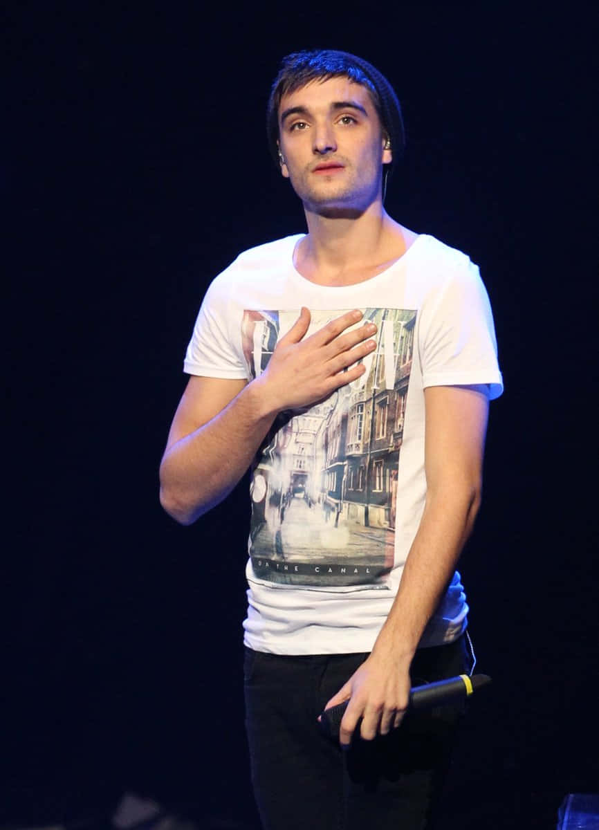 Tom Parker Striking A Pose During A Photoshoot. Wallpaper