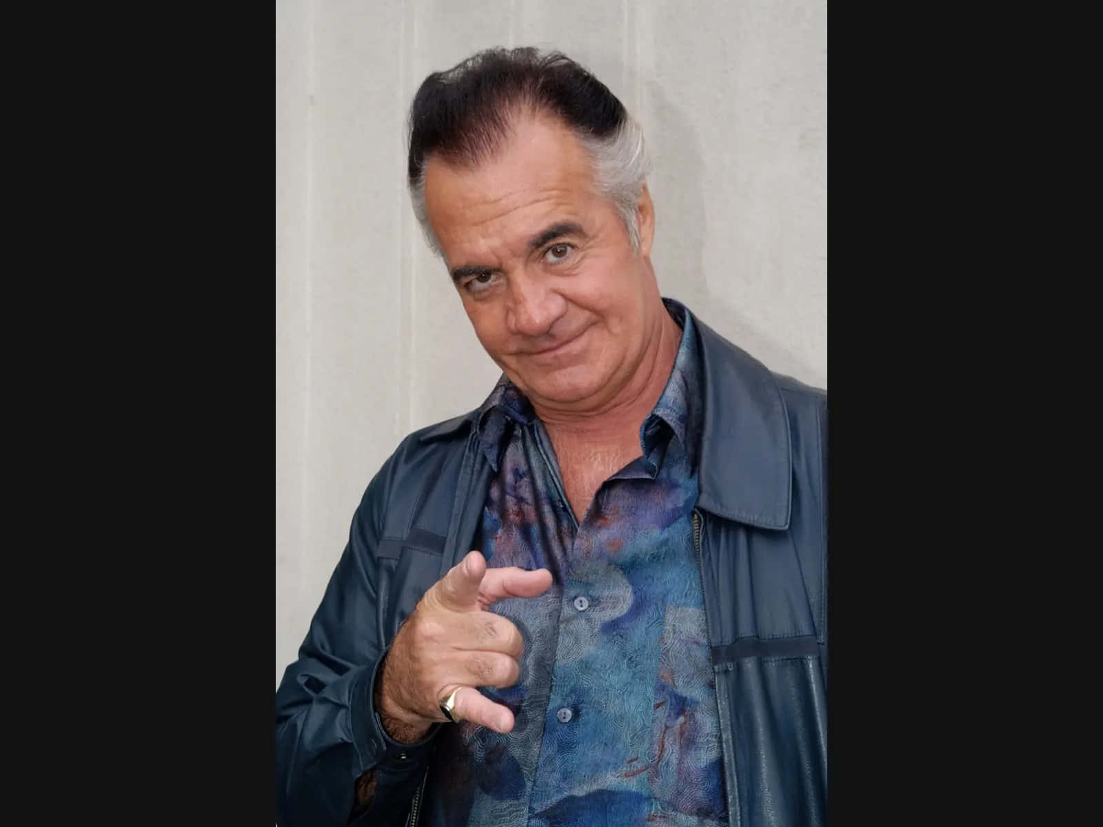 Tony Sirico Striking A Pose In A Stylish Suit Wallpaper