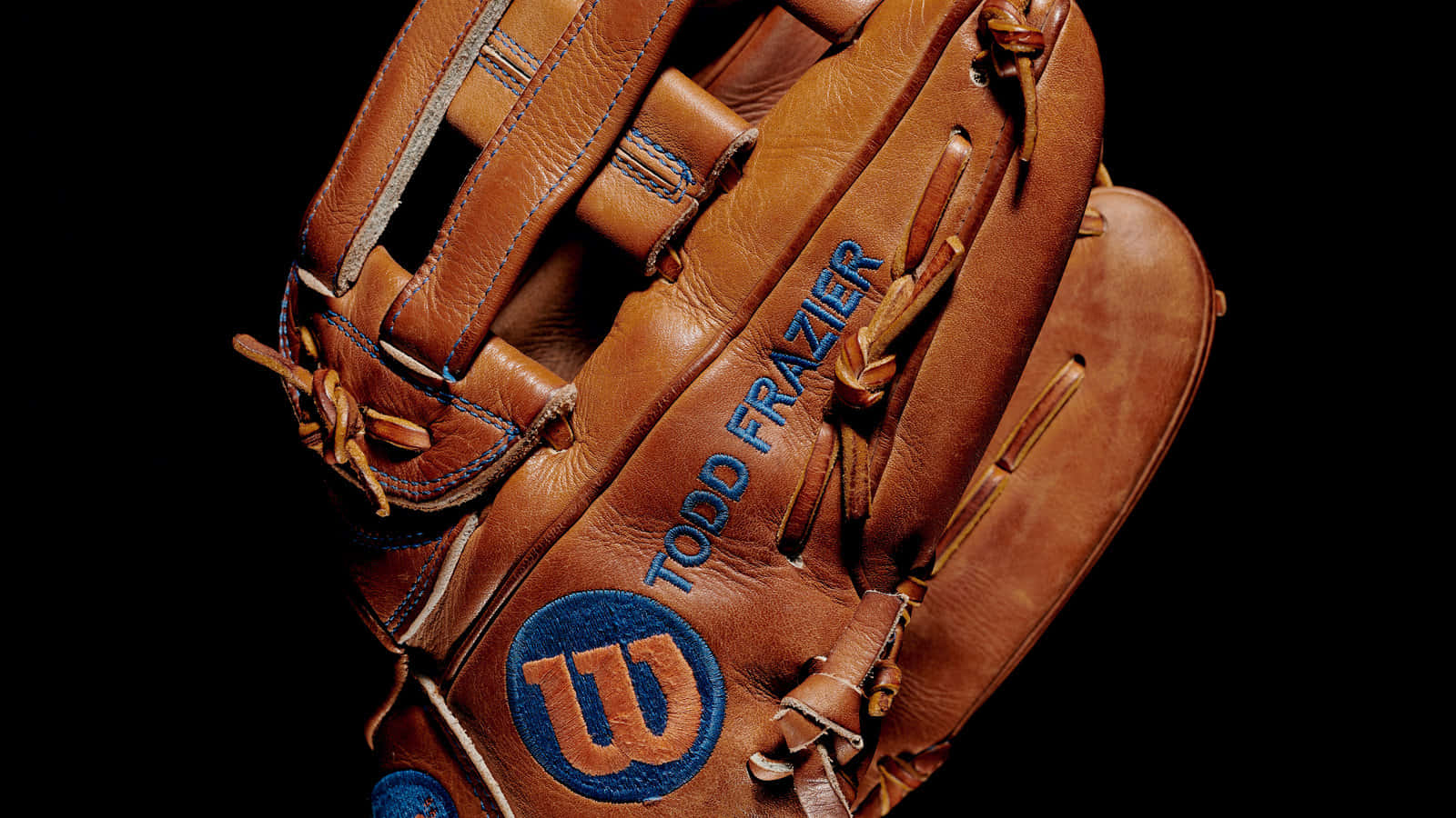 Top-quality Baseball Gloves Lined Up For The Game Wallpaper