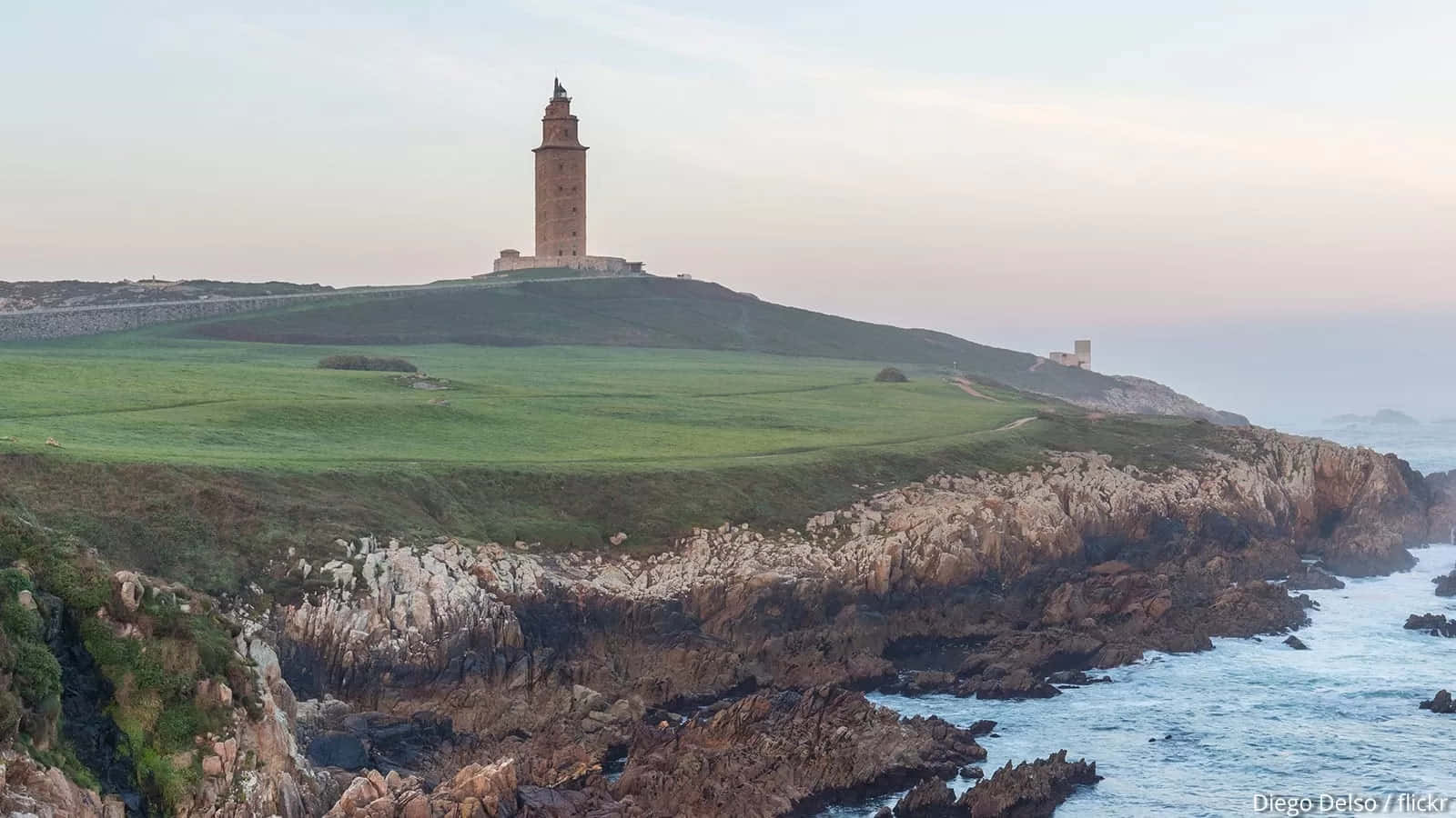 Tower Of Hercules Ocean Waves Below Wallpaper