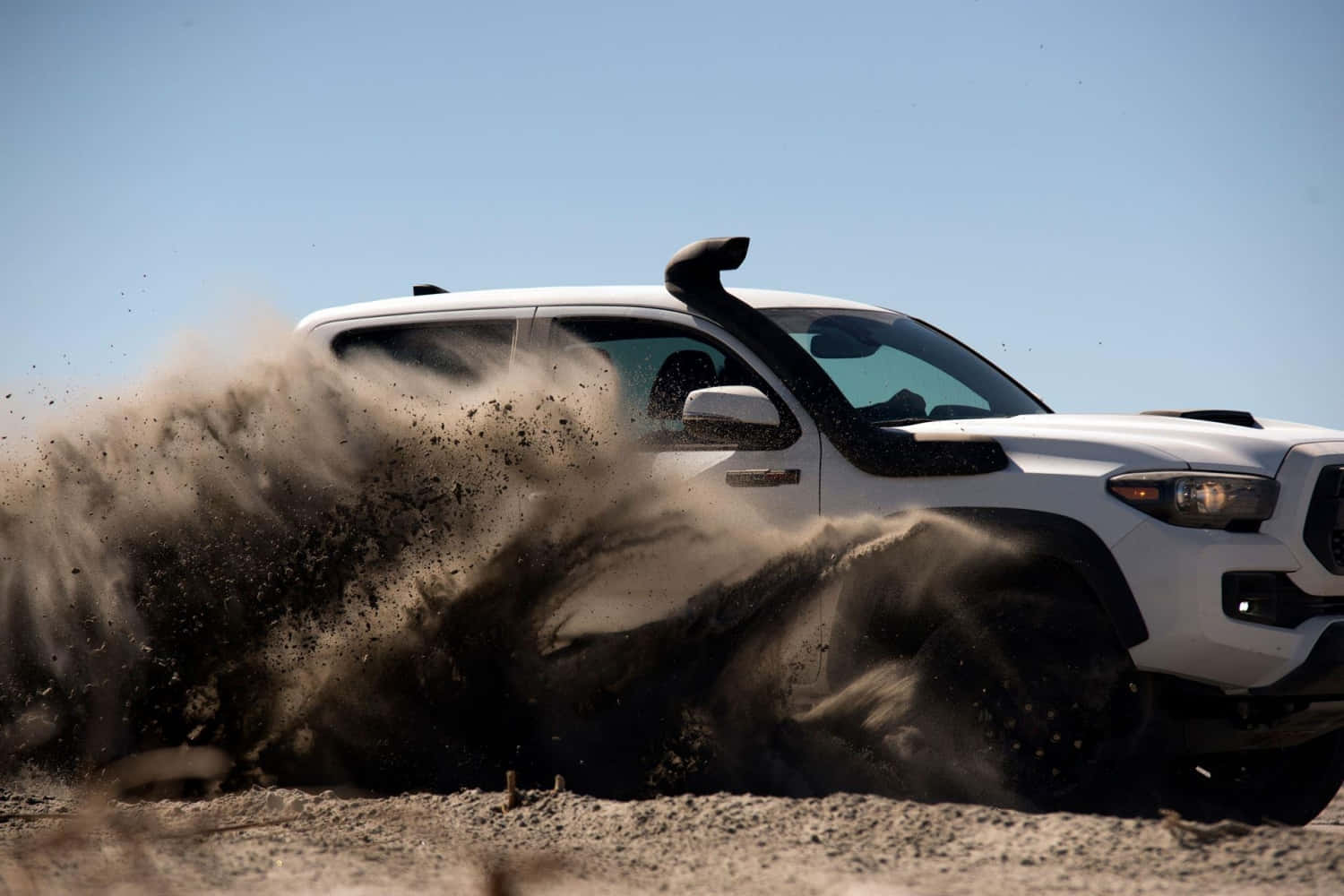 Toyota Trd Driving Through Dust Wallpaper