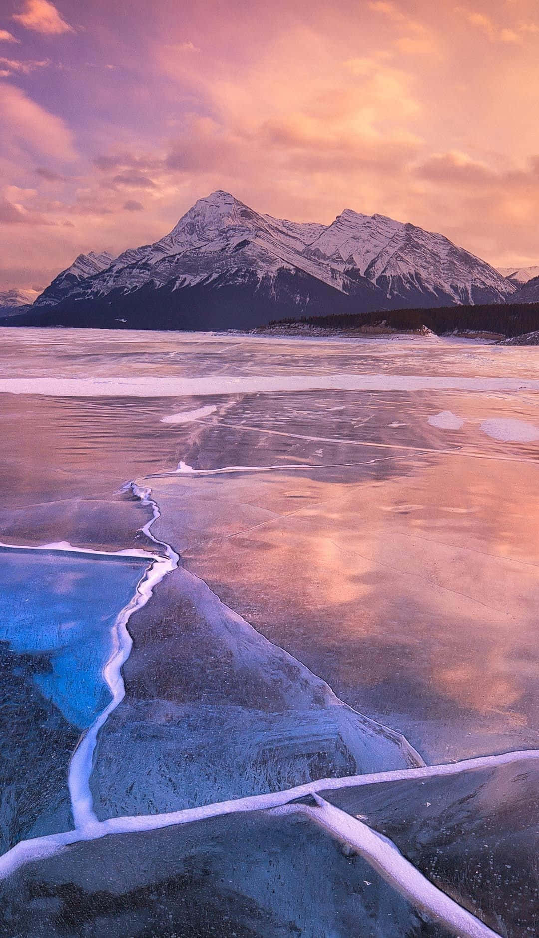 Tranquil Frozen Lake Sparkling Under The Wintry Sky Wallpaper