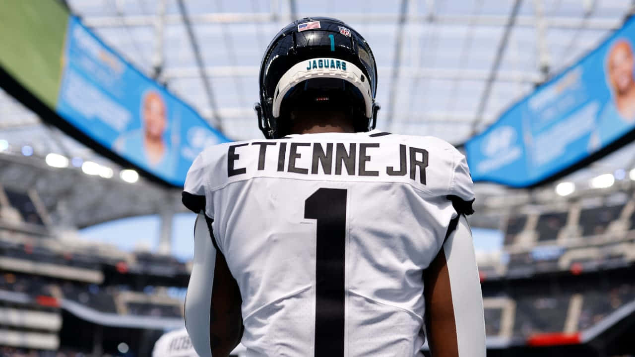 Travis Etienne Jr Jaguars Uniform Wallpaper