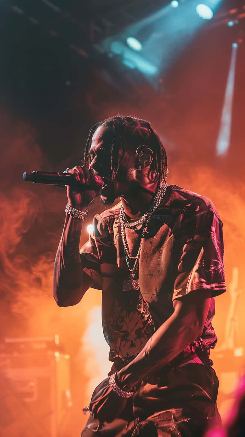 Travis Scott Performing Liveon Stage.jpg Wallpaper