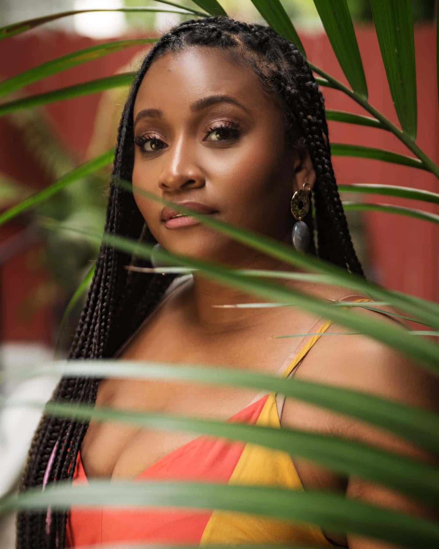 Tropical Portrait Woman Amongst Green Leaves Wallpaper