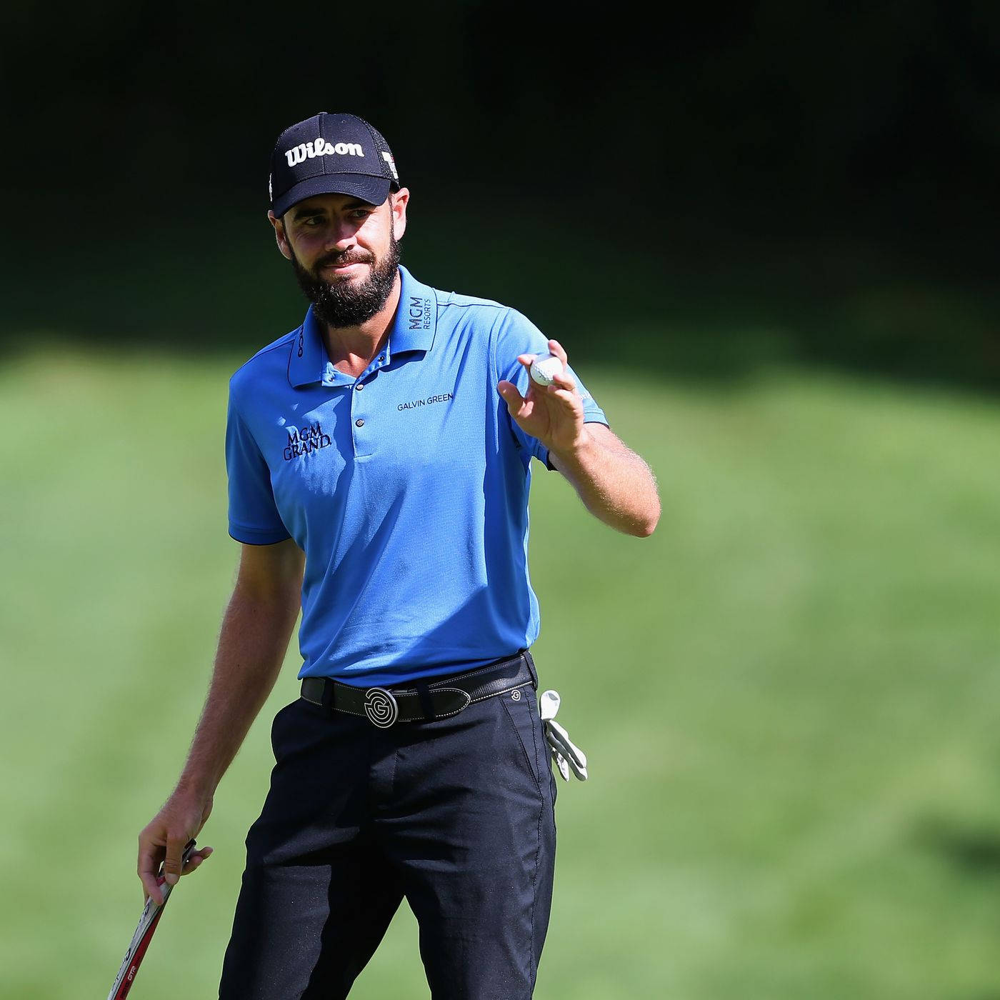 Troy Merritt Holding White Golf Ball Wallpaper