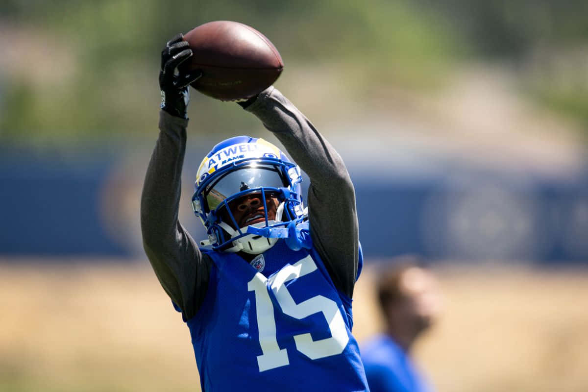 Tutu Atwell Catching Football Practice Wallpaper