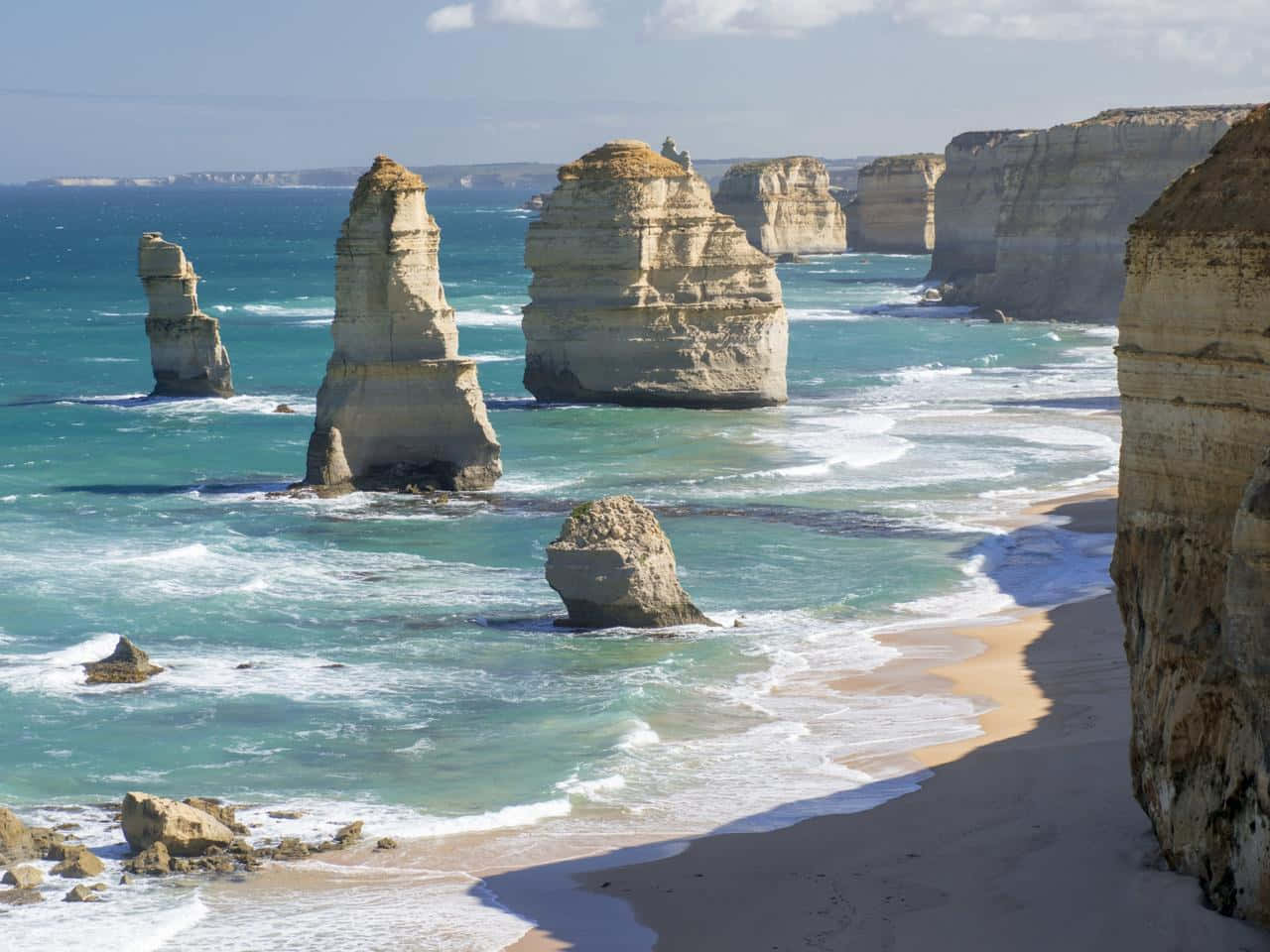 Twelve Apostles In Victoria Australia With Sunbeam Wallpaper