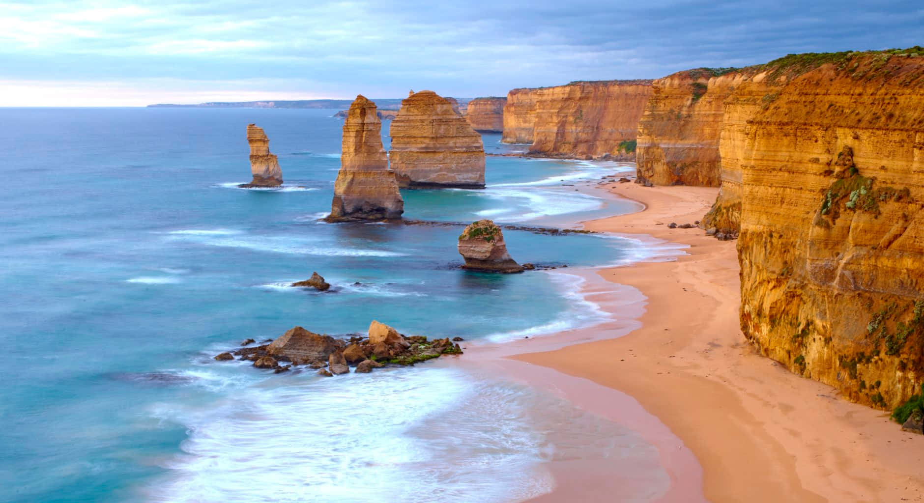 Twelve Apostles With Calm Waves In Victoria Australia Wallpaper