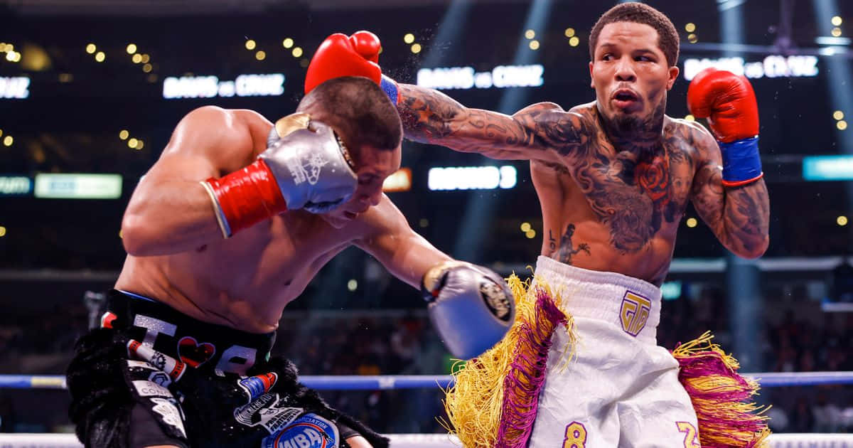 Two Boxers In Action In A Boxing Ring Wallpaper