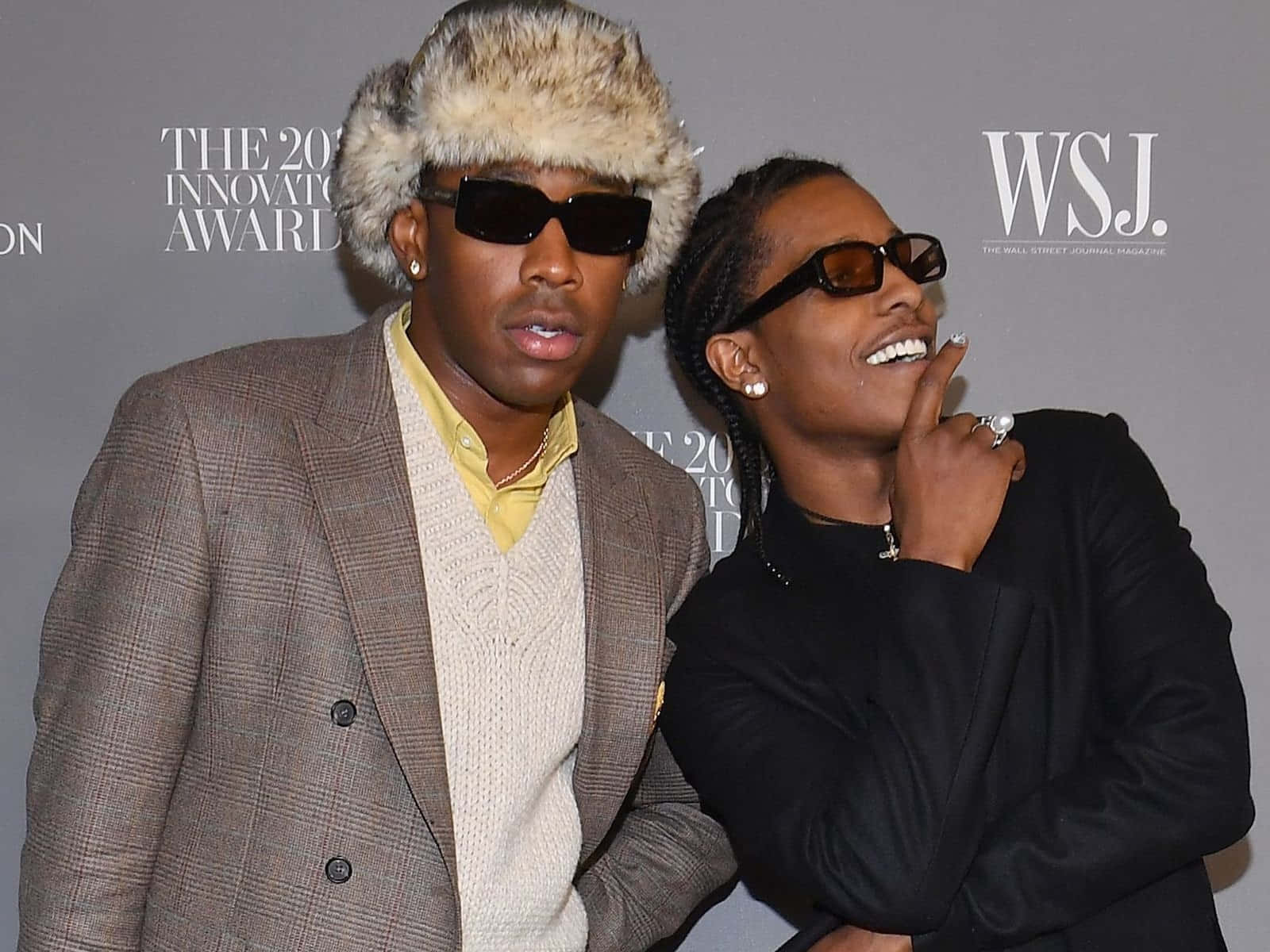 Two Men In Fur Hats Posing For A Picture Wallpaper