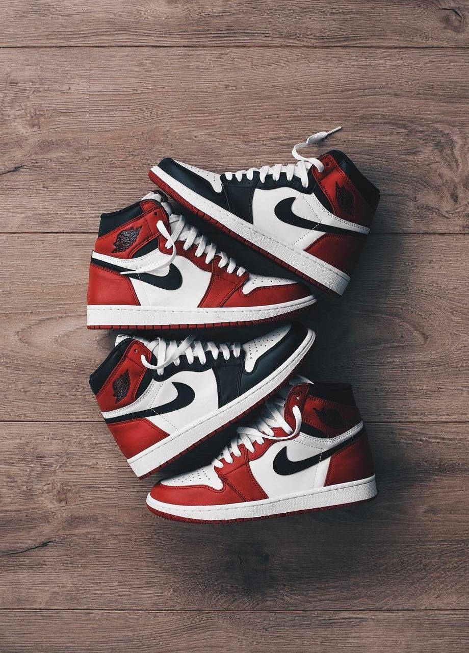 Two Pairs Of Nike Air Jordan 1 Retro Chicago Wallpaper