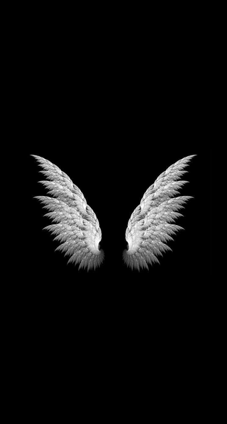 Two White Angel Wings On A Black Background Wallpaper