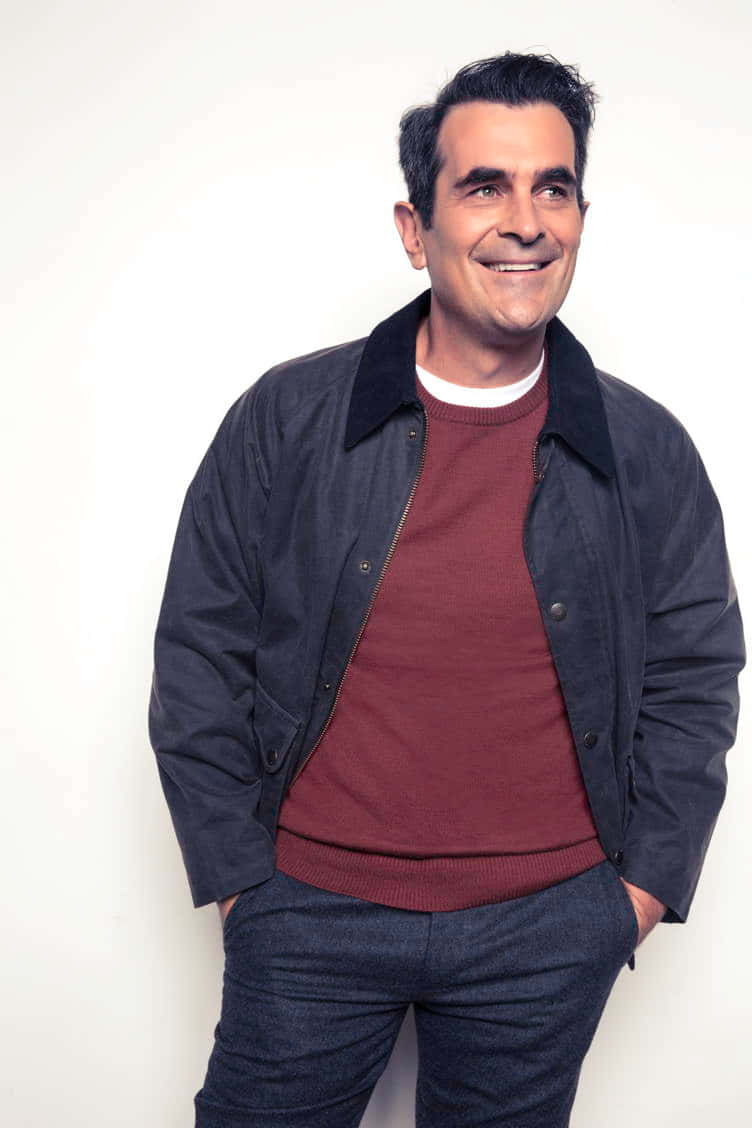 Ty Burrell Smiling During A Photoshoot Wallpaper