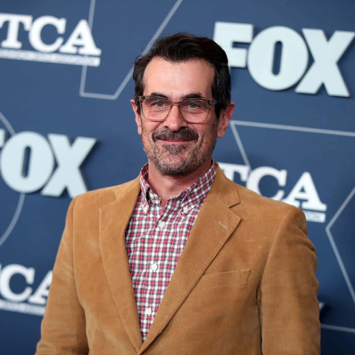 Ty Burrell Smiling Elegantly Wallpaper