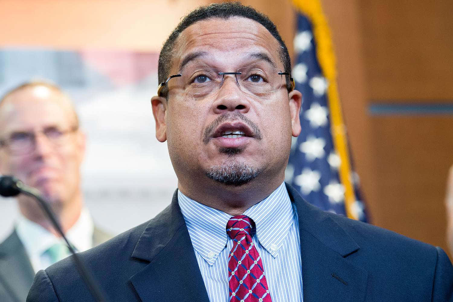 U.s. Representative Keith Ellison Reflectively Looking Up Wallpaper