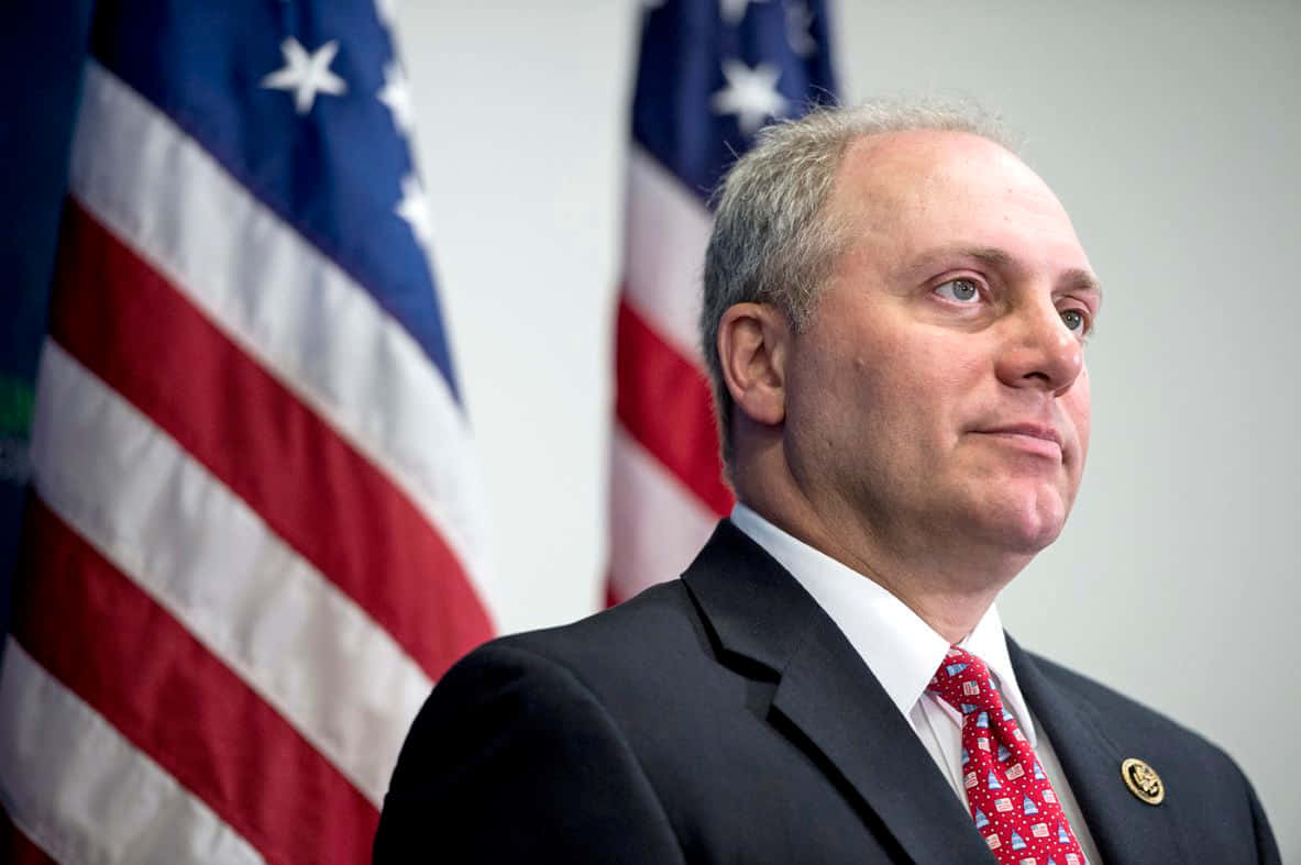 U.s. Representative Steve Scalise With American Flags In The Background Wallpaper