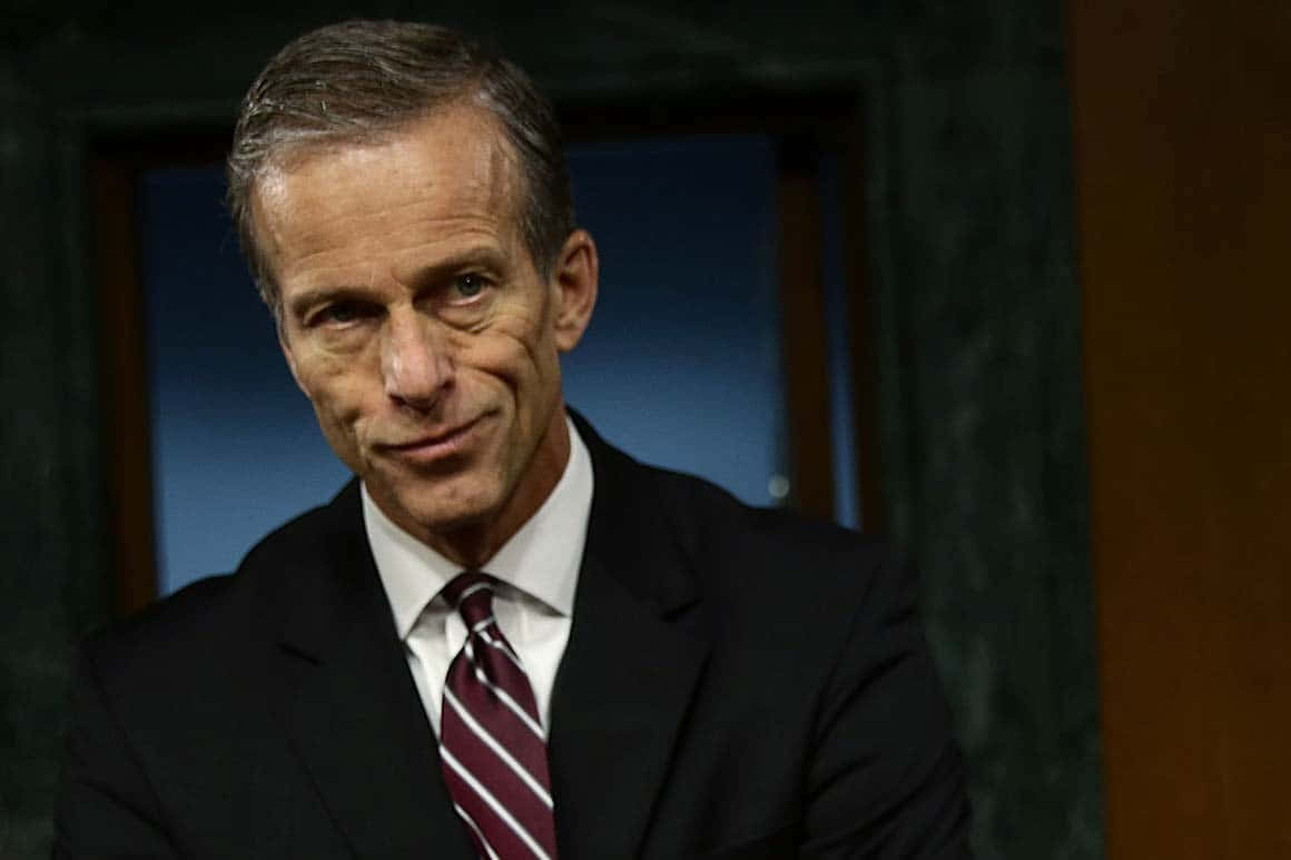 U.s Senator John Thune With A Smirking Expression Wallpaper