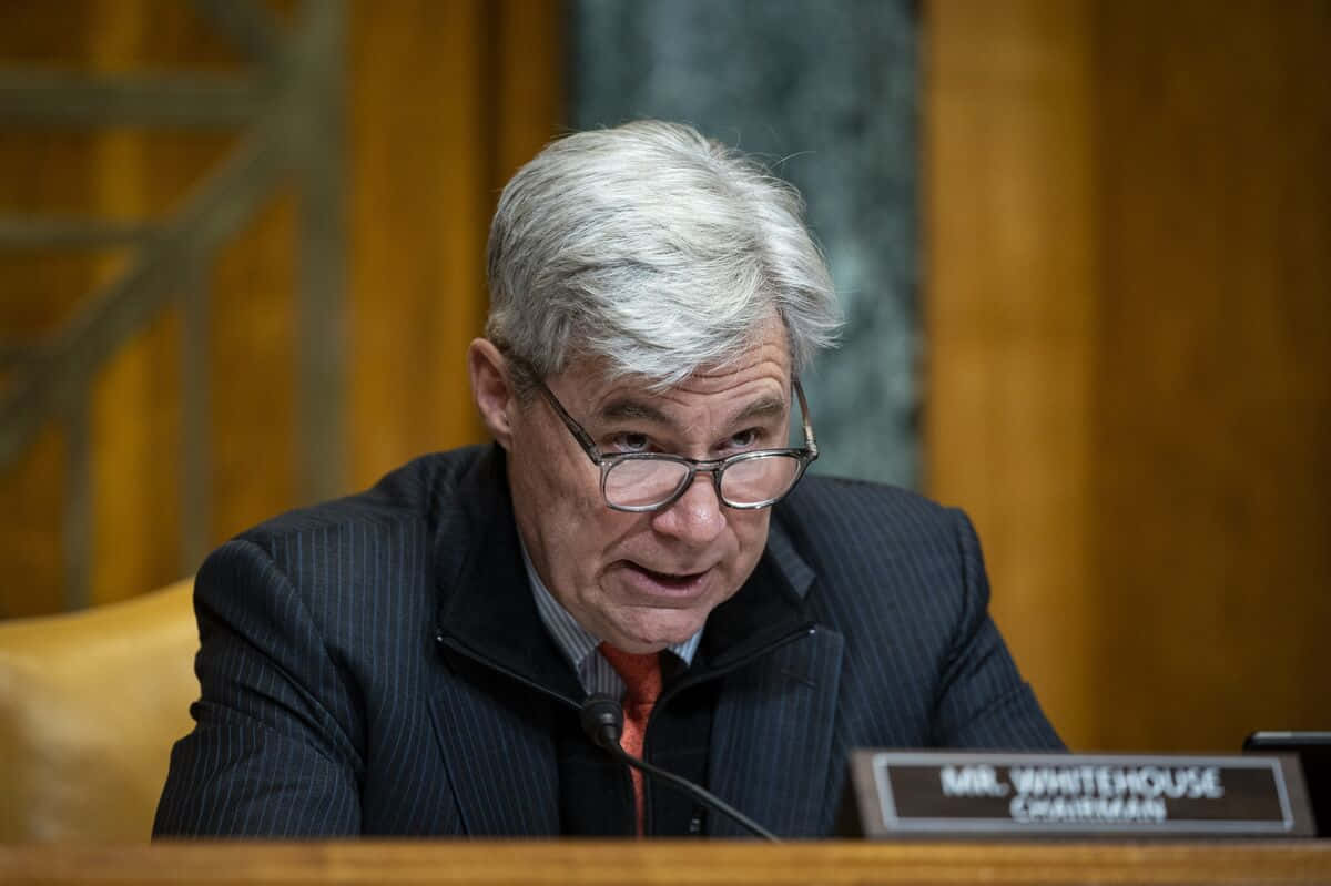 U.s. Senator Sheldon Whitehouse Delivering A Speech. Wallpaper