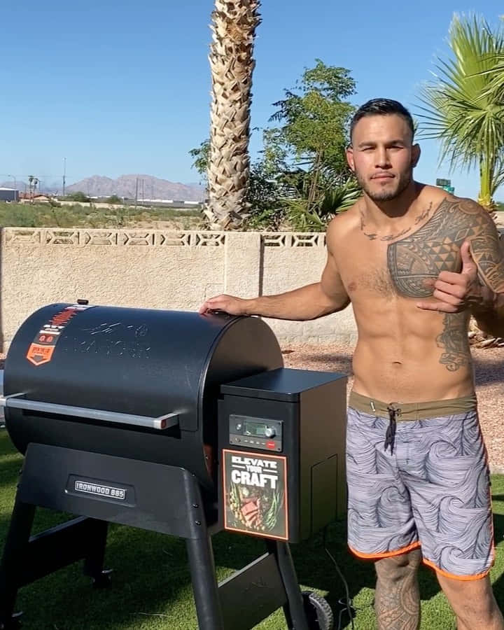 Ufc Fighter Brad Tavares Beside The Grill Wallpaper