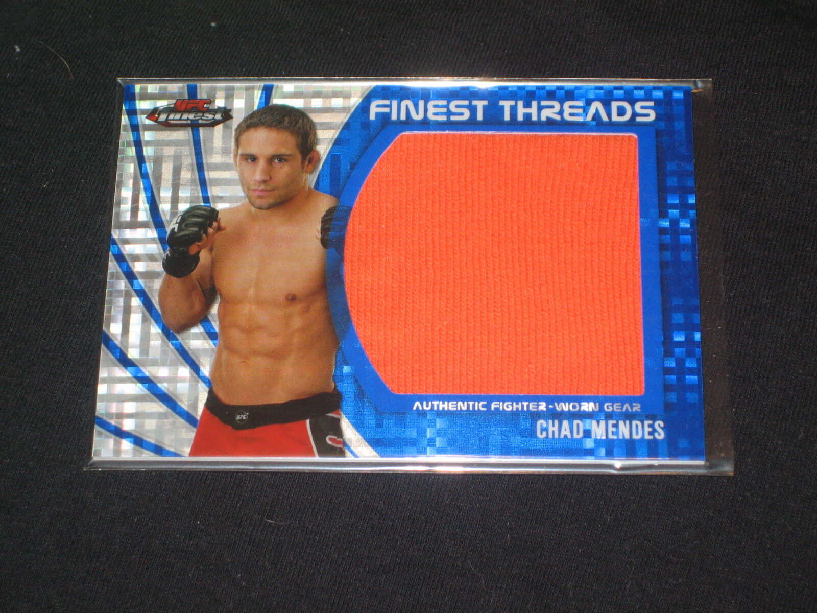 Ufc Star Chad Mendes Displaying His Memorabilia Card Wallpaper