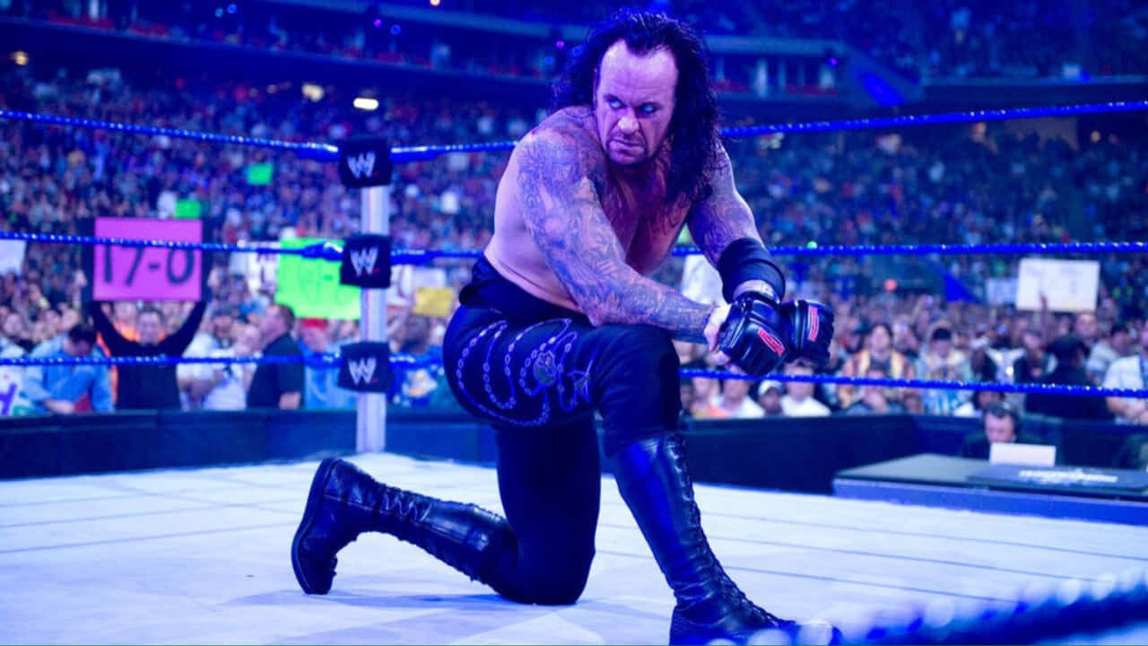 Undertaker Kneelingin W W E Ring Wallpaper