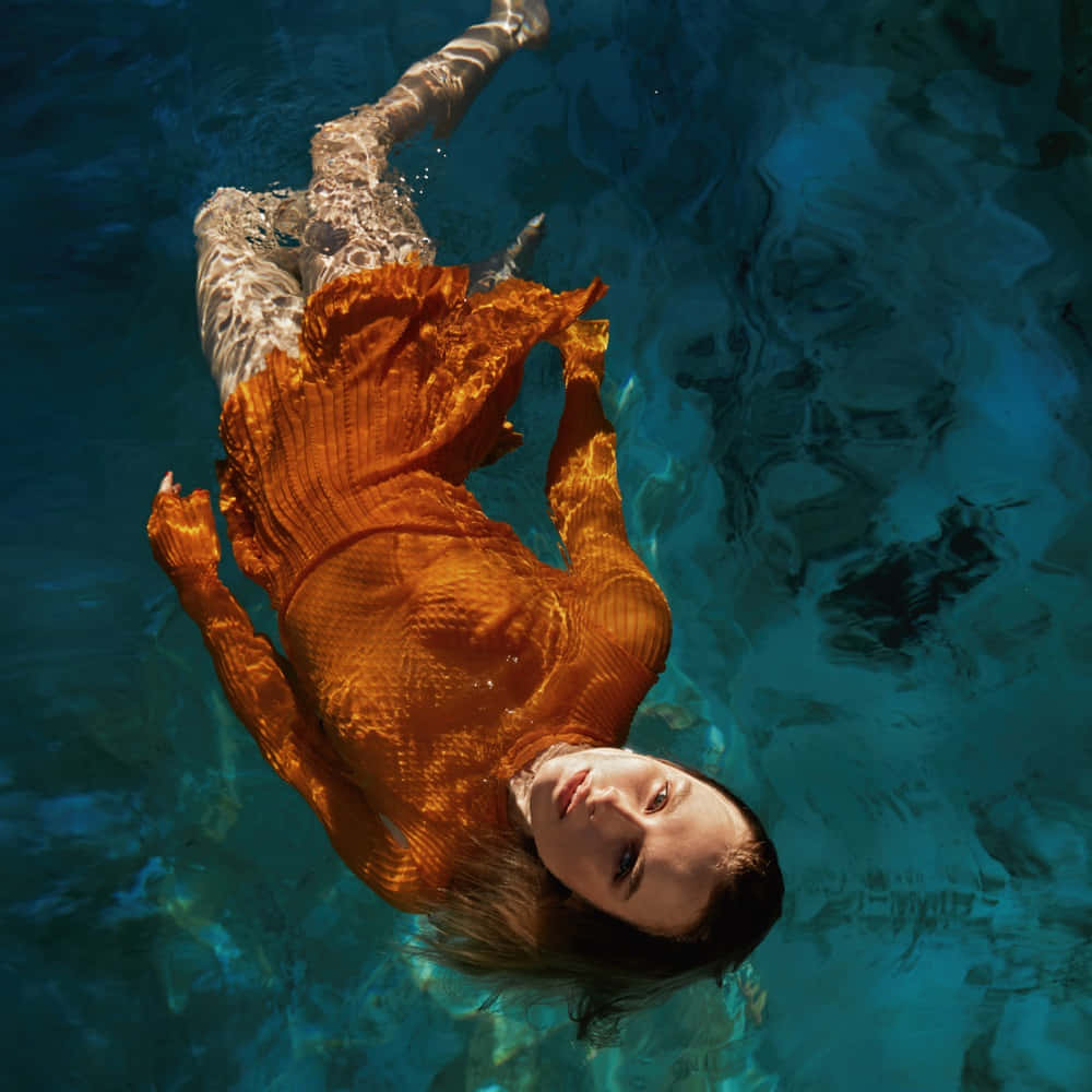 Underwater Elegancein Orange Dress Wallpaper