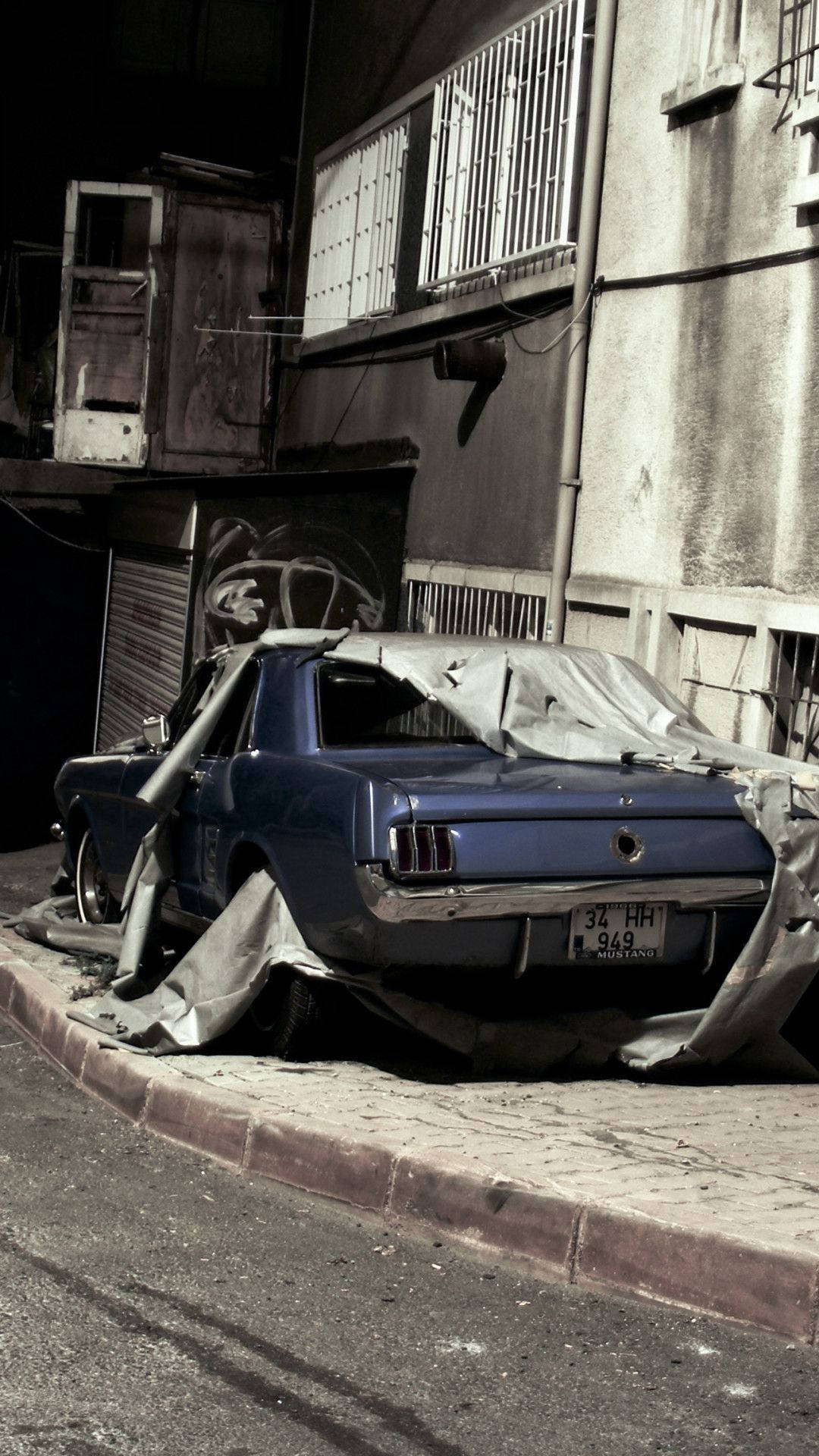 Unexpectedly Parking: A Crashed Car On A Building Wallpaper