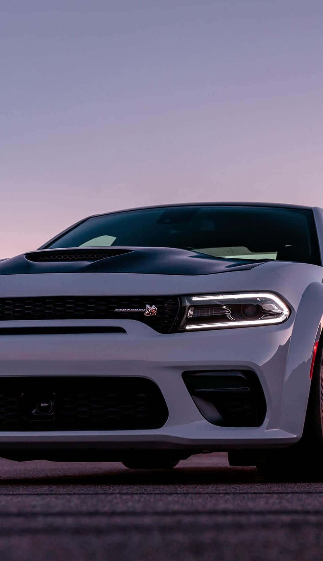 Upgrade Your Technology With This Dodge Charger Iphone Wallpaper Wallpaper