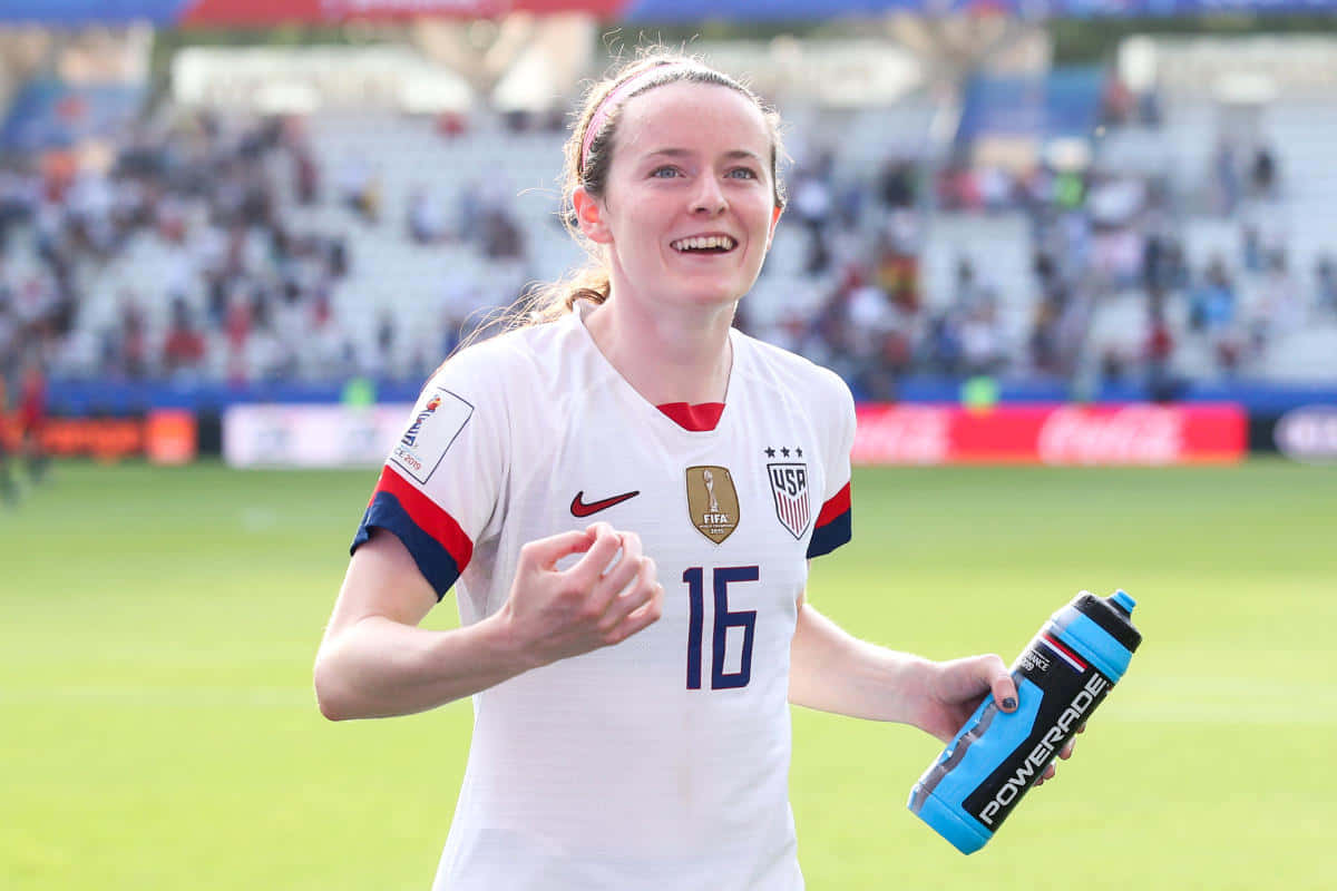 Usa's Rose Lavelle In Action During A Soccer Match Wallpaper