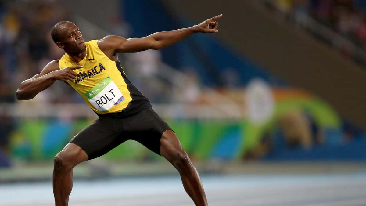 Usain Bolt Glowing With Victory In Signature Pose Wallpaper