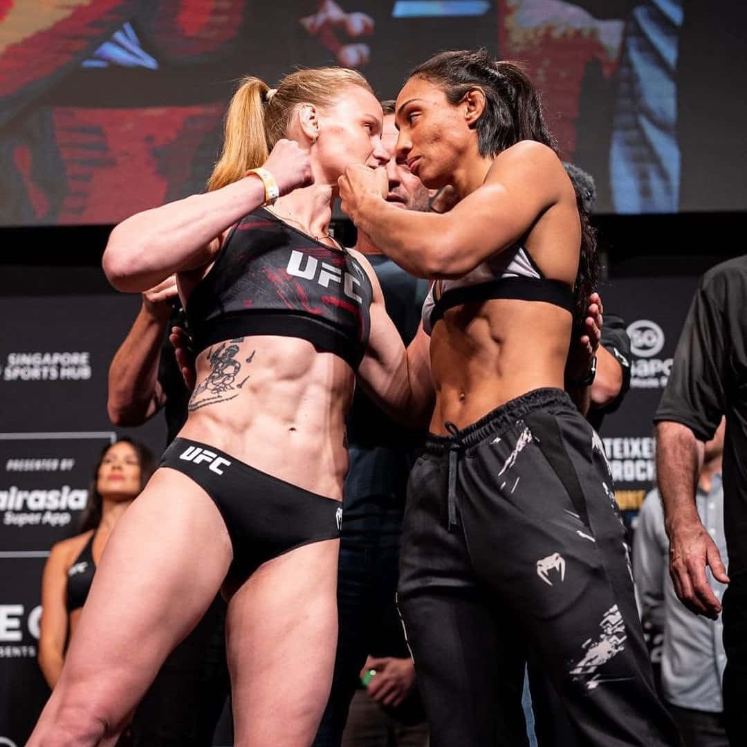 Valentina Shevchenko And Taila Santos Face Off Wallpaper