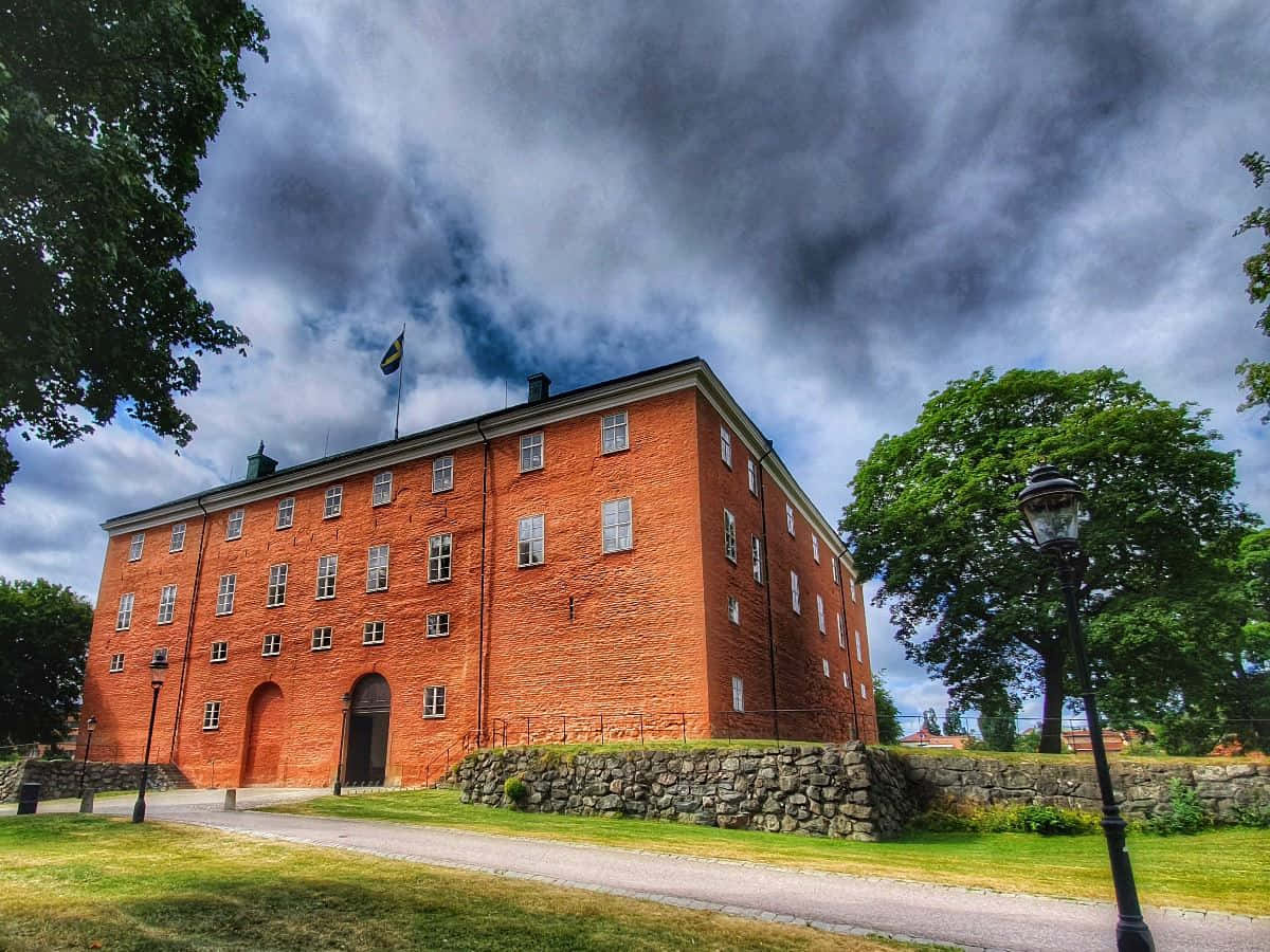 Vasteras Historical Building Under Cloudy Sky Wallpaper