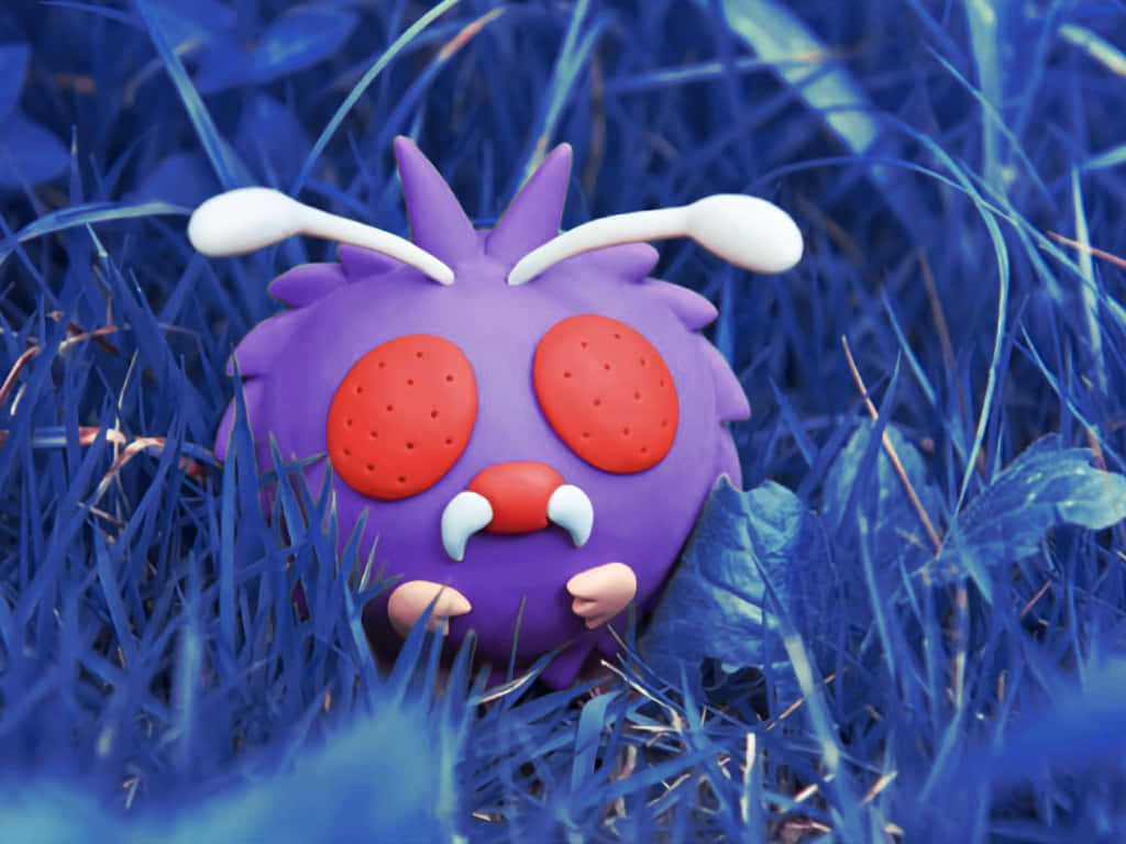 Venonat Toy On Blue Grass Wallpaper