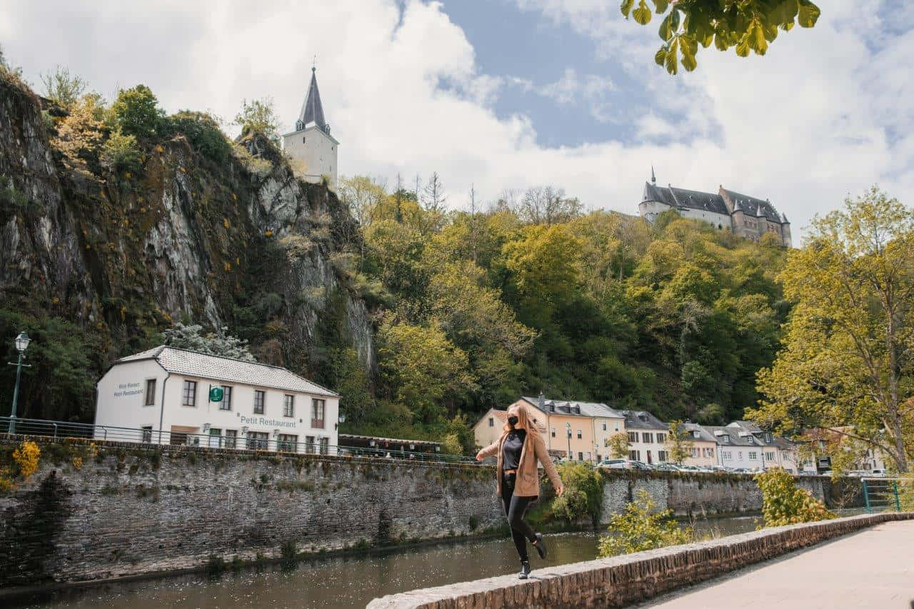 Vianden Castle Overlooking Riverand Town Wallpaper