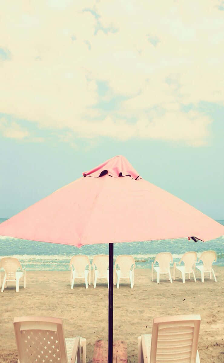 Vibrant Beach Umbrella On A Sunny Day Wallpaper