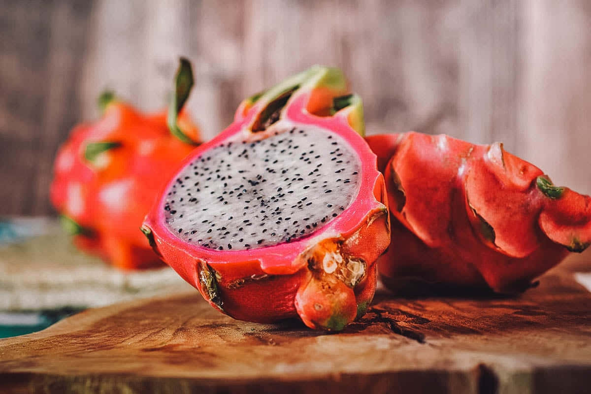 Vibrant Red Fruits On A Serene Backdrop Wallpaper